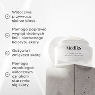 Słoiczek kremu Medik8 C-Tetra Cream umieszczony na szarym kamiennym bloku na białym tle, w otoczeniu delikatnych promieni światła. Na zdjęciu widnieją cztery zaznaczone hasła reklamowe:
Widocznie przywraca blask skórze
Poprawia wygląd drobnych zmarszczek i nierównego kolorytu skóry
Odżywia i zmiękcza skórę
Pomaga zapobiegać widocznym oznakom starzenia się skóry