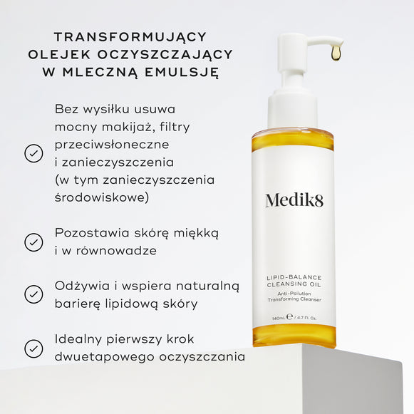 Butelka olejku oczyszczającego Lipid-Balance stoi na białym podkładce. W opisie wymieniono zalety produktu, w tym usuwanie intensywnego makijażu, wzmacnianie bariery lipidowej oraz działanie jako olejek do demakijażu, który zmienia konsystencję w mleczko.-hover-19