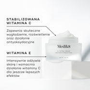 Słoiczek kremu Medik8 C-Tetra przedstawiony w stanie otwartym na białym kamiennym bloku na czystym białym tle. Na zdjęciu widoczne są dwa kluczowe składniki oraz ich zalety:

STABILIZOWANA WITAMINA C: Zapewnia silne działanie wygładzające, rozjaśniające oraz przeciwutleniające.

WITAMINA E: Głęboko odżywia i wzmacnia działanie witaminy C, zapewniając maksymalne efekty.